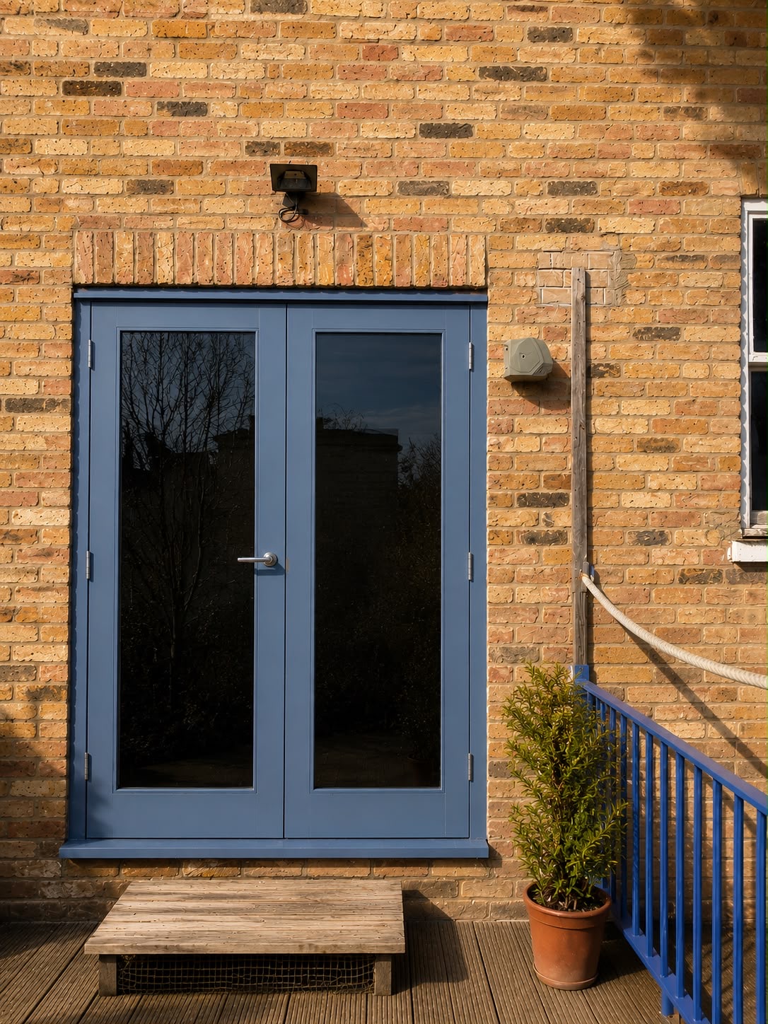 Blue French doors with glass panels